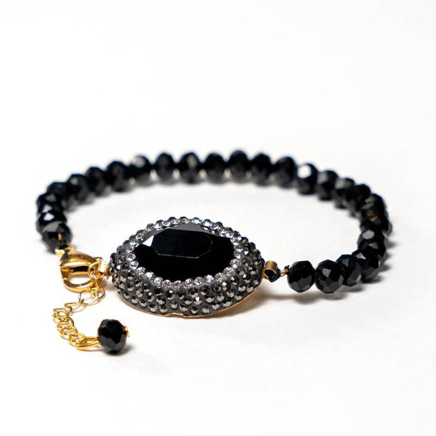 Handcrafted Grania bracelet featuring a strand of black beads with a sparkling black zirconia stone centerpiece - Anima Collection by Iottigleam