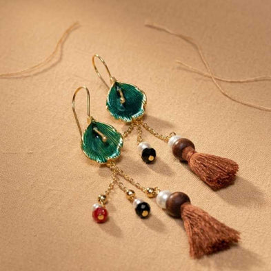 Close-up of unique artisanal pieces by IottiGleam featuring natural stones and high-end handcrafted finishes for daily wear.