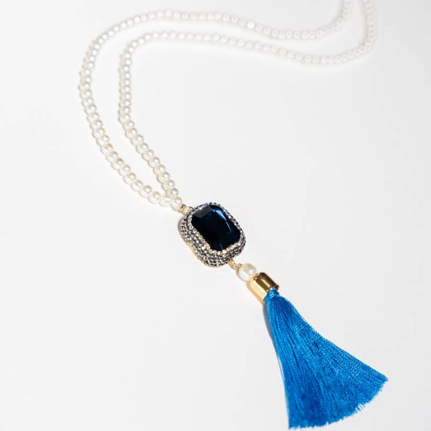 Handcrafted Ceres necklace featuring a bright blue zirconia center stone and white glass pearls - Anima Collection by Iottigleam