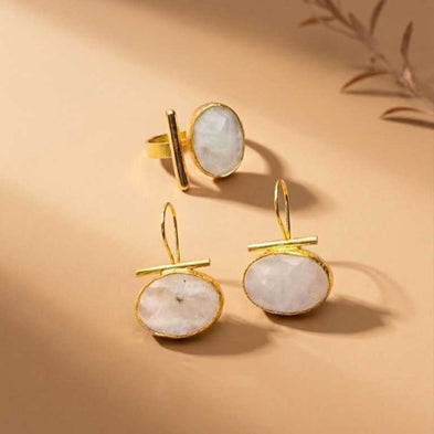 Curated set of gold-plated rings and bracelets by IottiGleam; classy minimal stacking accessories for everyday elegance.