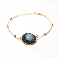 Handcrafted Embla chain bracelet featuring a centered blue quartz stone on a polished gold-plated link chain - Anima Collection by iottigleam