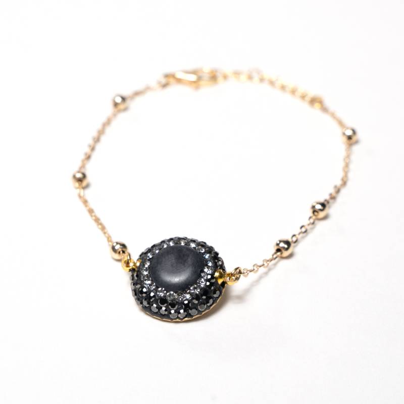 Handcrafted Embla chain bracelet featuring a smoky grey quartz stone on a gold-plated link chain - Anima Collection by iottigleam.