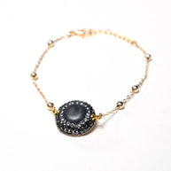 Handcrafted Embla chain bracelet featuring a smoky grey quartz stone on a gold-plated link chain - Anima Collection by iottigleam.