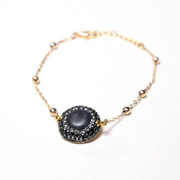 Handcrafted Embla chain bracelet featuring a smoky grey quartz stone on a gold-plated link chain - Anima Collection by iottigleam.