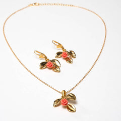 1. The Recommended Alt Text
Handcrafted Frosya accessory set featuring a gold-plated necklace with a petals-shaped pendant and matching earrings with pink flower ornaments - Anima Collection by iottigleam