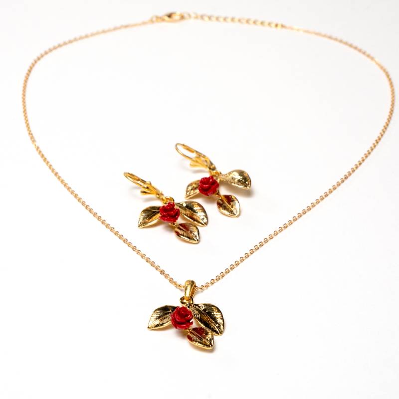 Handcrafted Frosya accessory set featuring a gold-plated necklace with a petals-shaped pendant and matching earrings with red flower ornaments - Anima Collection by iottigleam