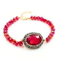 Handcrafted Grania II bracelet featuring high-shine red beads and a brilliant centered red zirconia stone - Anima Collection by iottigleam