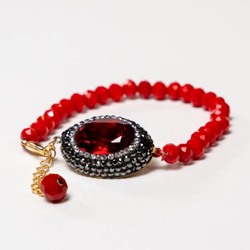 Handcrafted Grania bracelet featuring red matte beads with a centered, oval shape red zirconia stone - Anima Collection by iottigleam