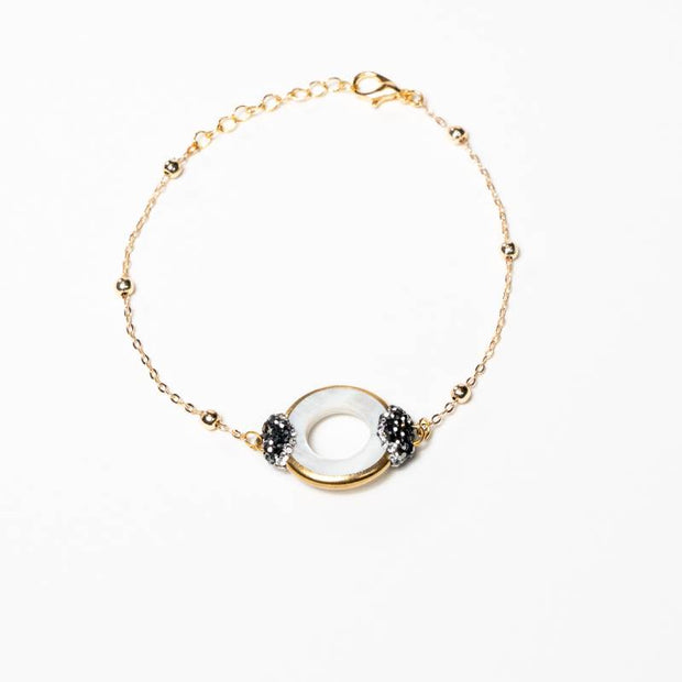Handcrafted Iris II chain bracelet featuring a radiant natural sea shell centerpiece on a high-shine gold-plated link chain - Anima Collection by iottigleamchain.