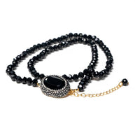 Handcrafted Kali multi-line bracelet featuring several strands of black beads with a centered black zirconia stone - Anima Collection by iottigleam