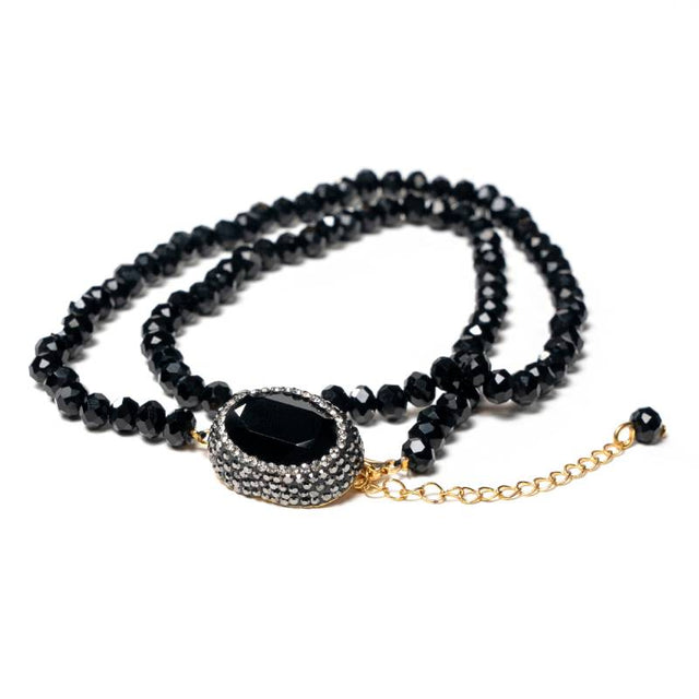 Handcrafted Kali multi-line bracelet featuring several strands of black beads with a centered black zirconia stone - Anima Collection by iottigleam