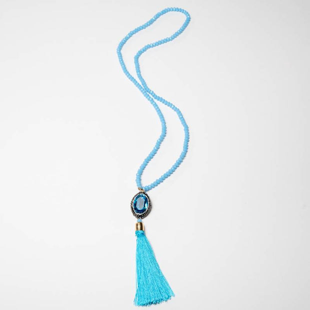 Handcrafted Melia necklace featuring a brilliant blue zirconia center stone set among delicate blue beads - Anima Collection by Iottigleam