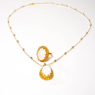 Handcrafted Zarina accessory set featuring a gold-plated necklace with a framed mother of pearl pendant and a matching mother of pearl ring - Anima Collection by iottigleam